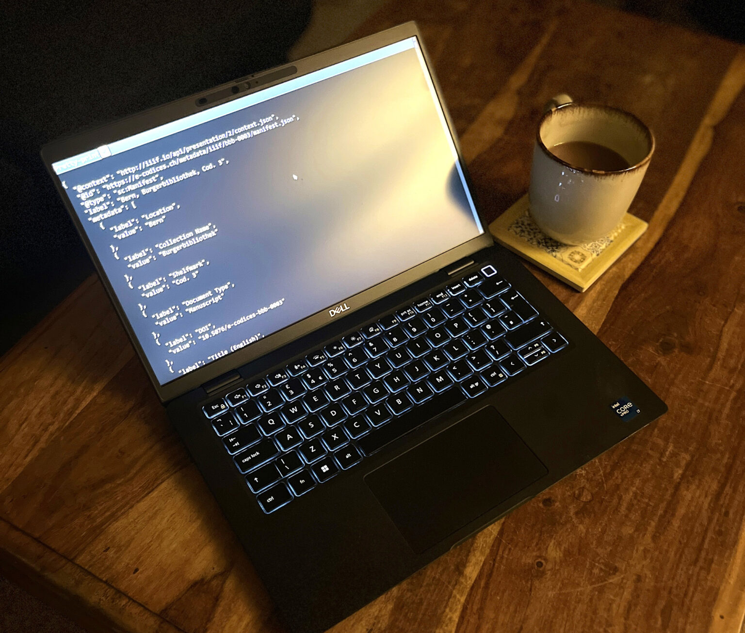 IMG_0429-edited Image of an open laptop on a wooden table with a mug of tea